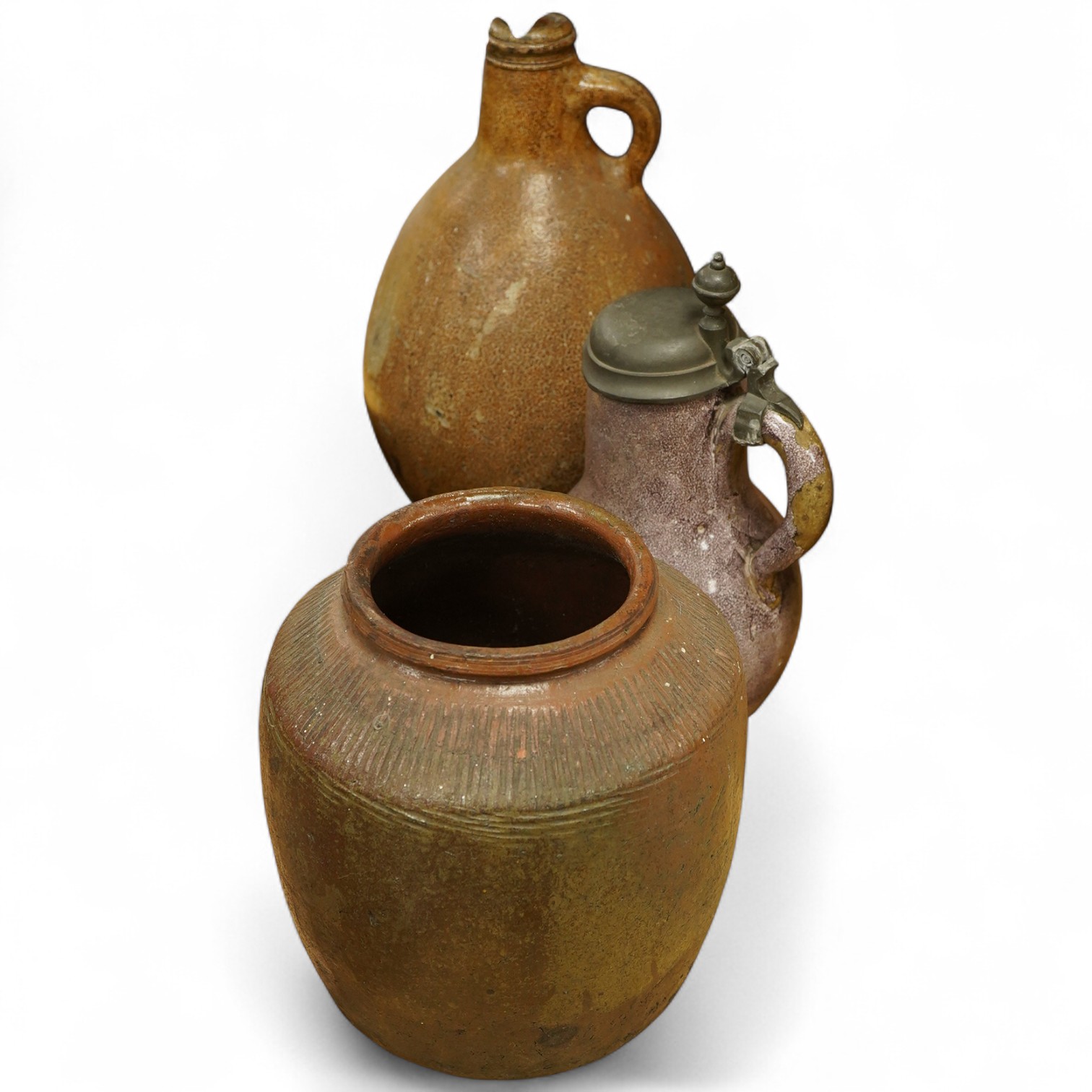 A lead glazed and manganese pewter-mounted ewer, a salt glazed pitcher and a terracotta pot, tallest 35cm